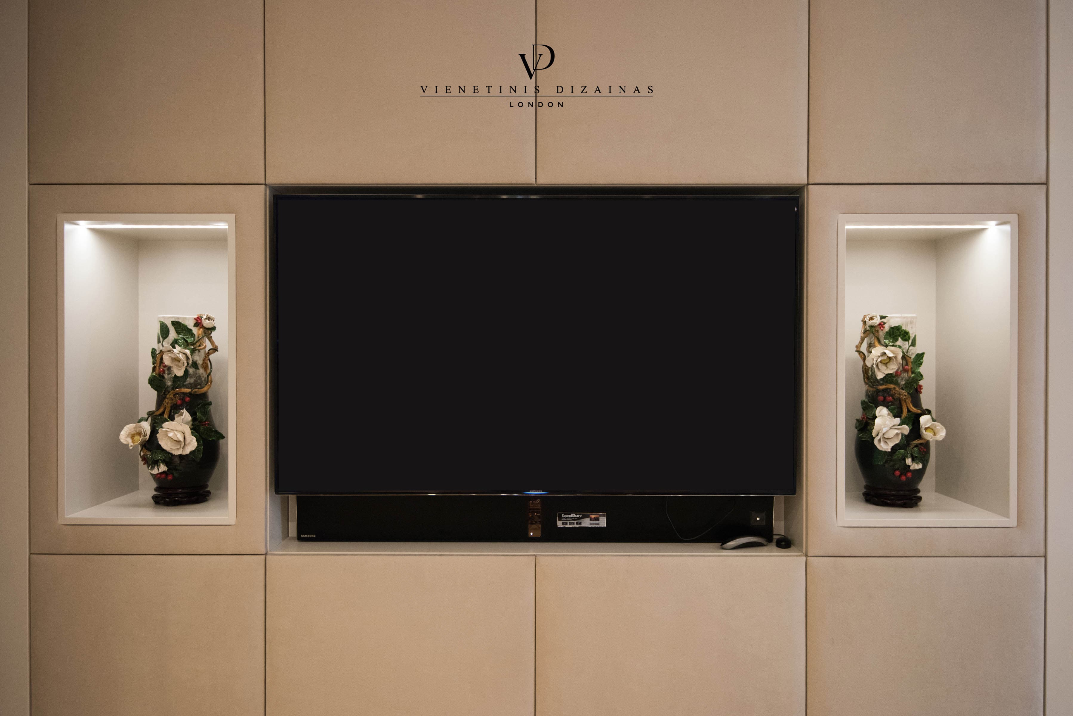 Cream bespoke fitted TV unit in a living room