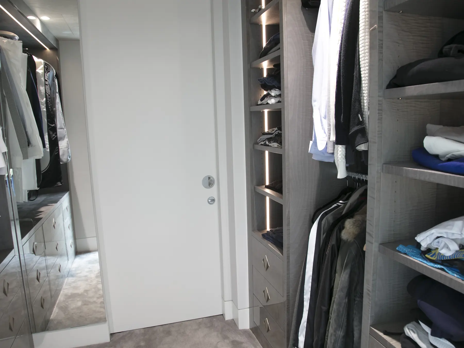 Full aisle view through Soho walk-in wardrobe