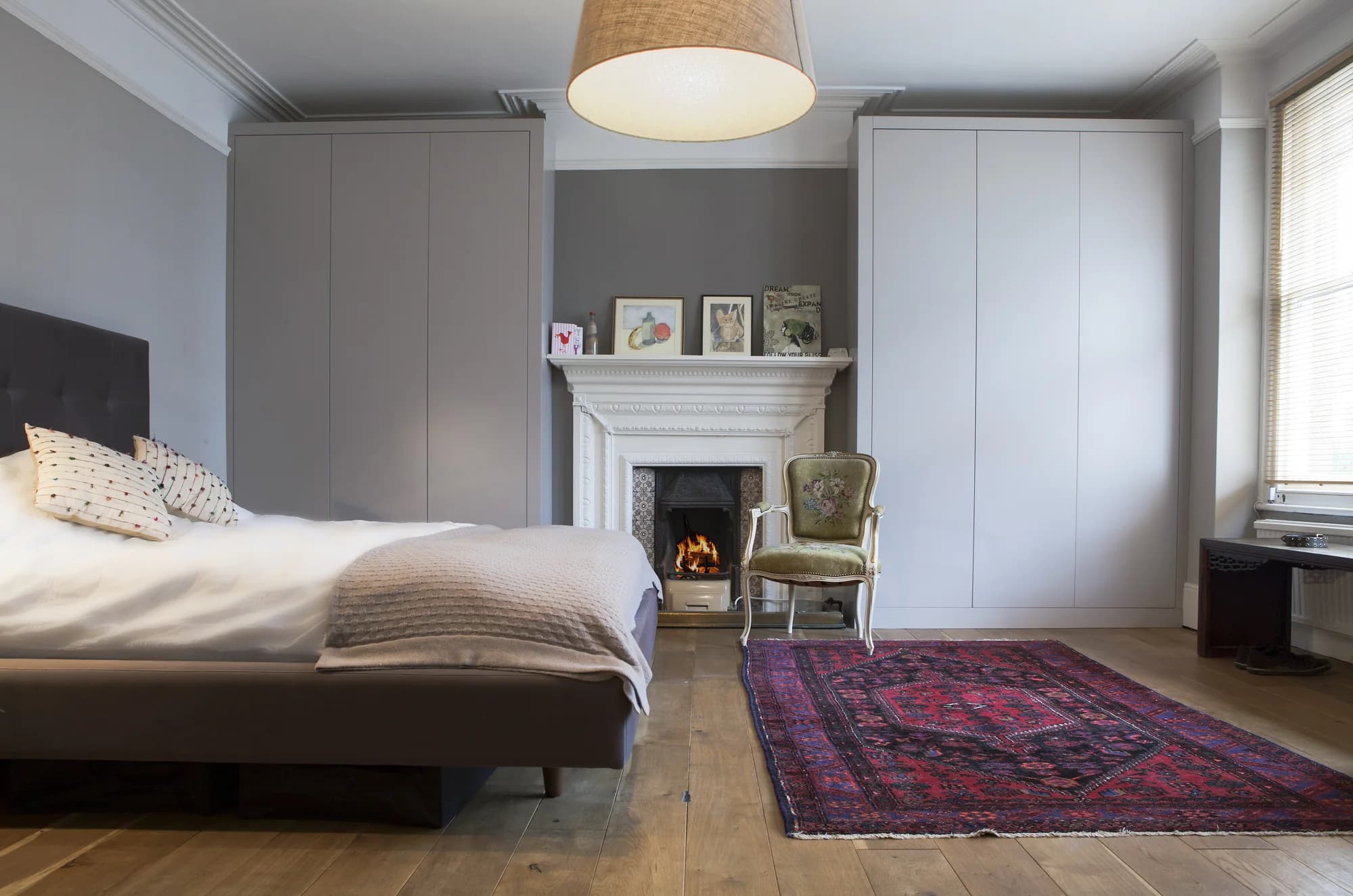 Closed view of Highgate fitted wardrobes around the fireplace