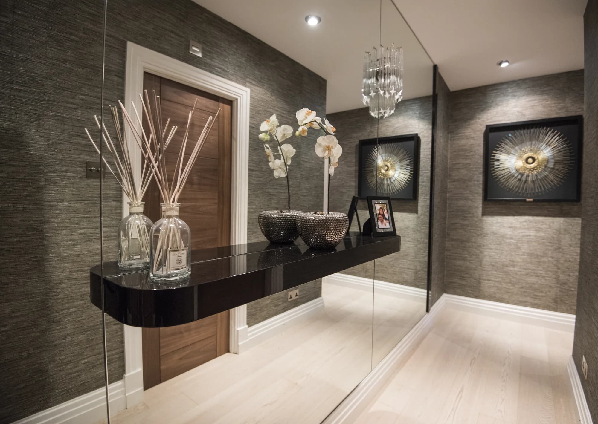 Floating display shelf and mirrored wall feature in Earls Court