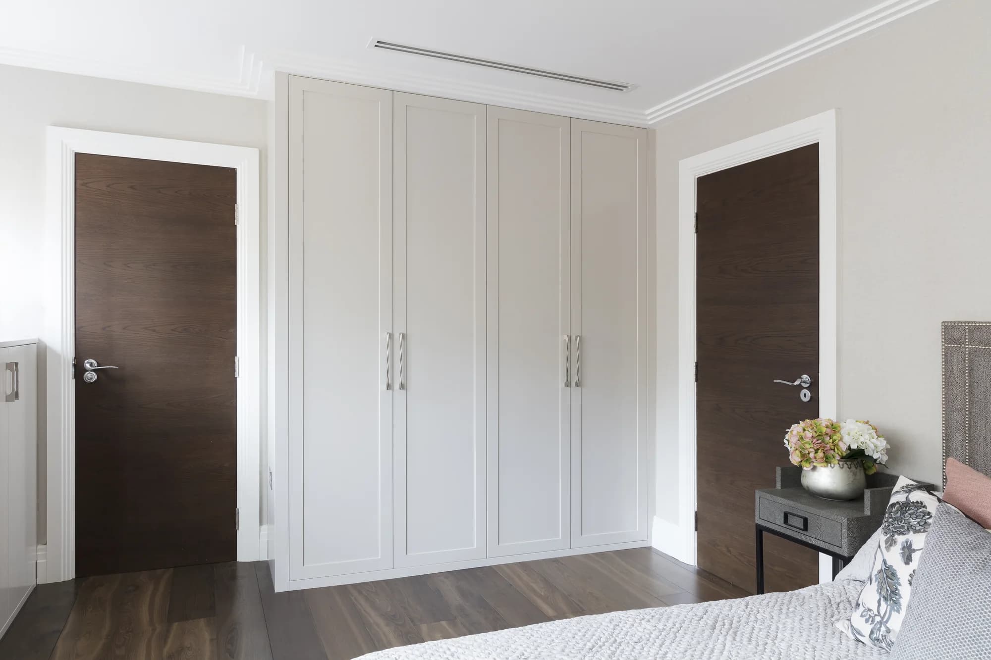 Closed doors on the full-height fitted wardrobe