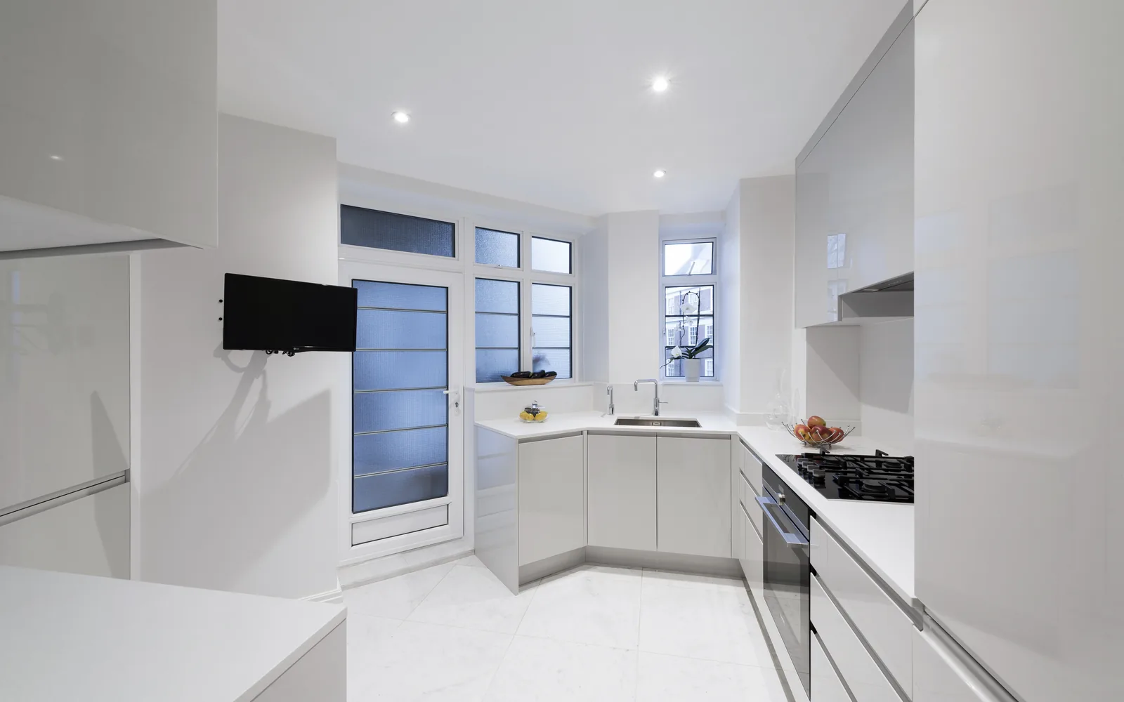 Completed white handleless kitchen installation